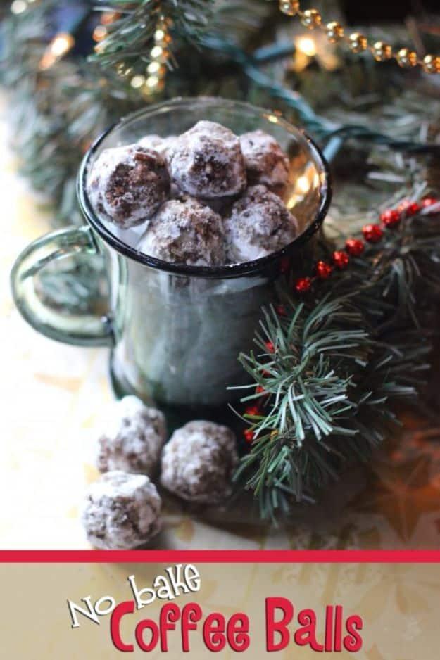 No bake coffee balls rolled in powdered sugar filling a green glass mug, pine and a red beaded garland