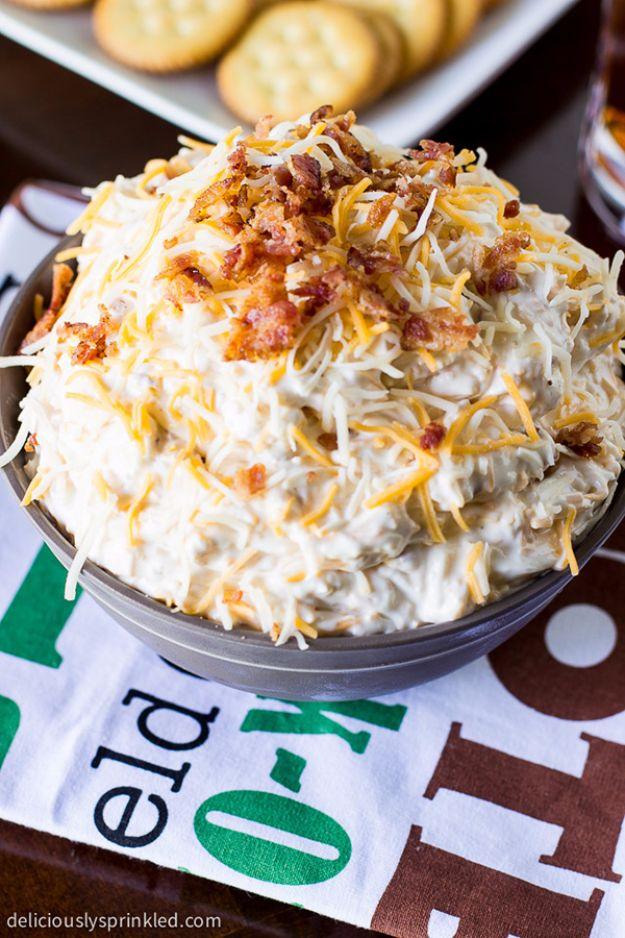 Bacon cheddar pretzel dip in a bowl with crumbled bacon and cheddar, served with hard salted pretzels