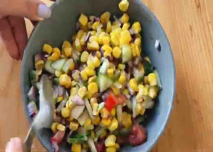 Mixing all the ingredients for the corn salad