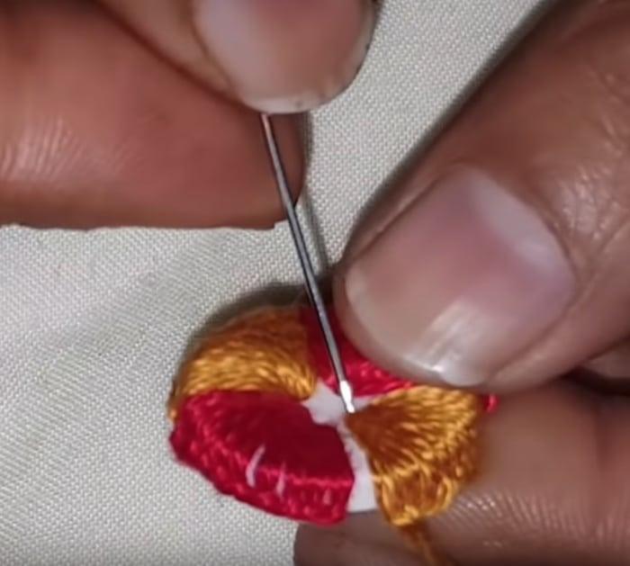Make hand embroidered buttons.