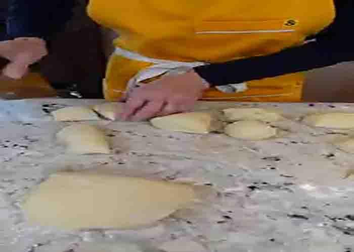 Dividing the dough to make the fluffy dinner rolls