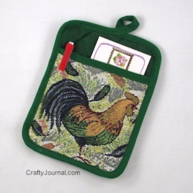 Pot holder sewn with a built in notepad pocket for jotting recipes down while cooking in the kitchen