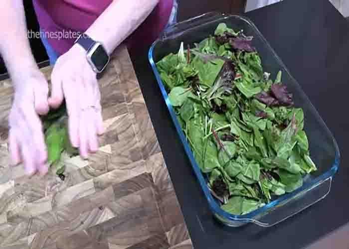 Layering the cake pan spring salad