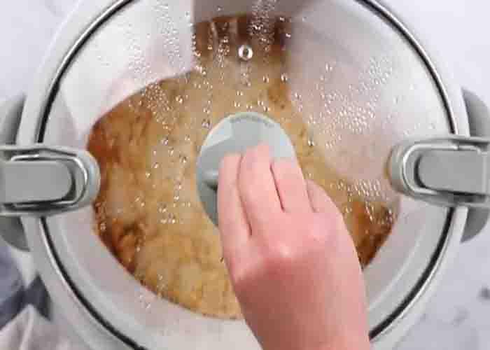 Cooking the peach cobbler in the crockpot