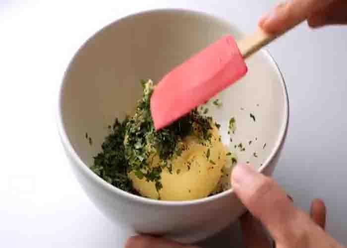 Making the butter garlic mixture for the garlic bread
