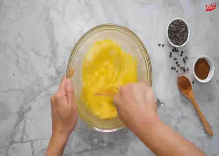 Combining the ingredients to make the brownie batter