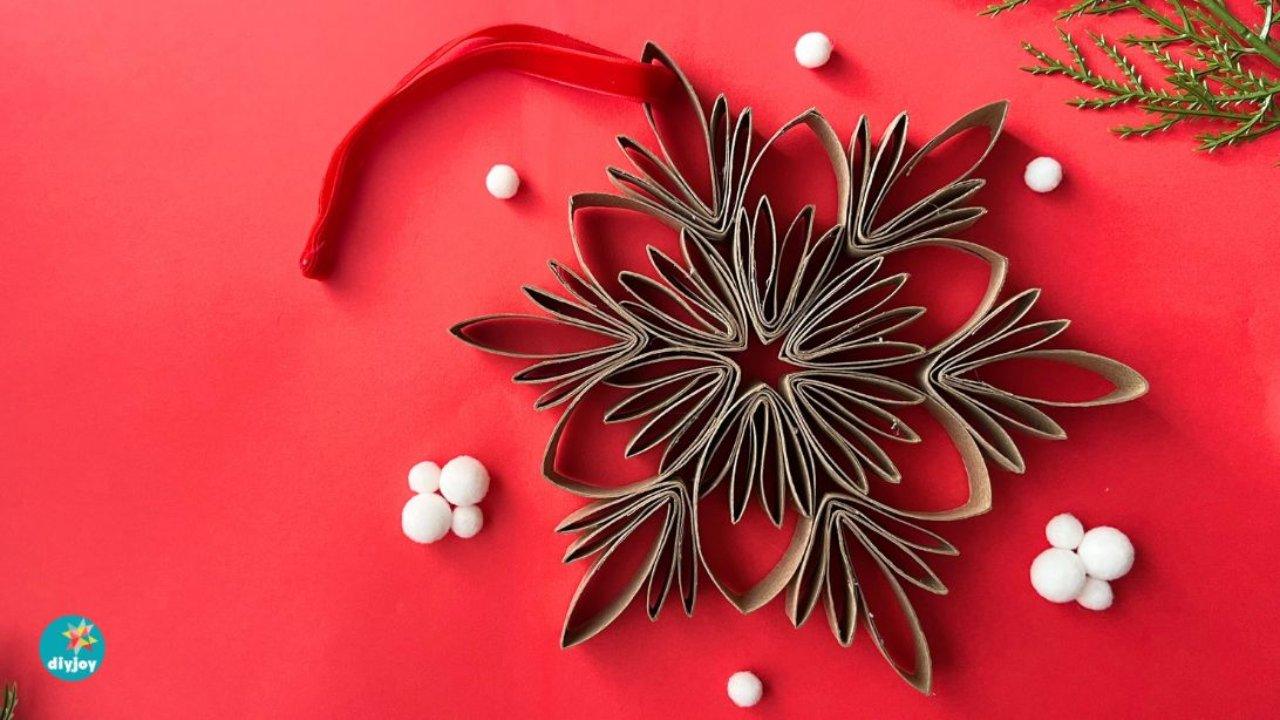 Make Beautiful DIY Snowflake Ornaments With Toilet Paper Rolls — easy step-by-step DIY tutorial.