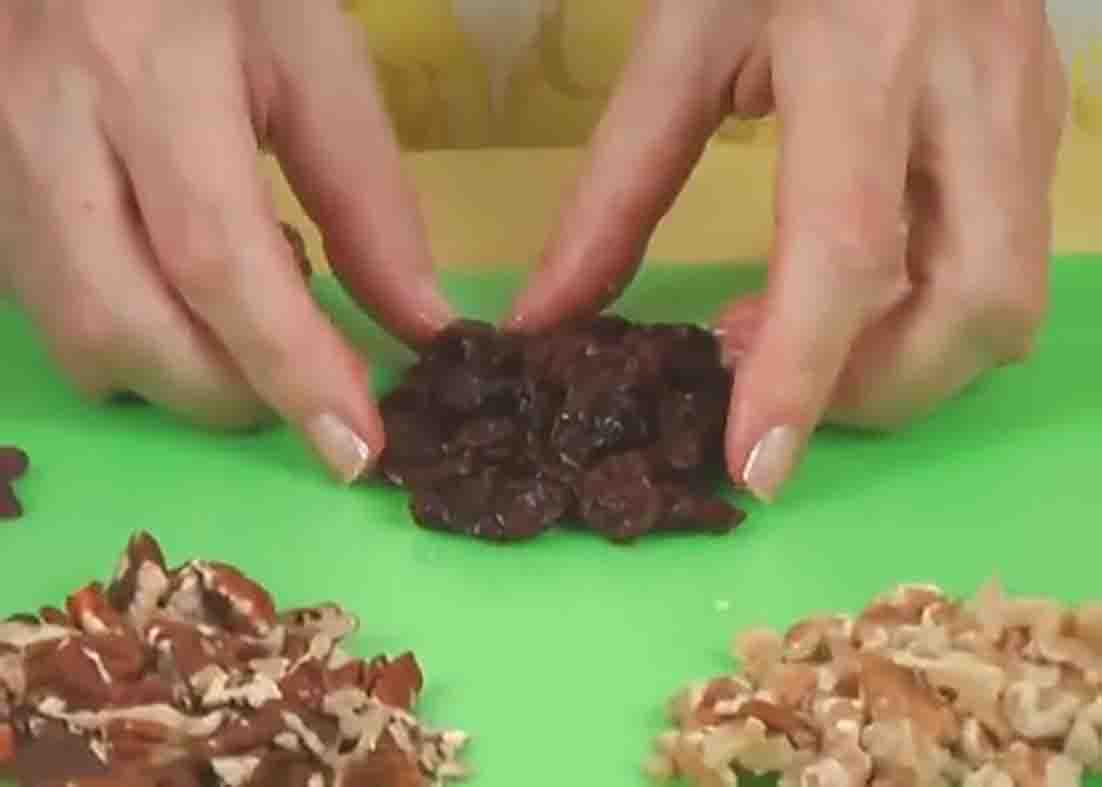 Adding dried pecans and roasted nuts to the granola mixture