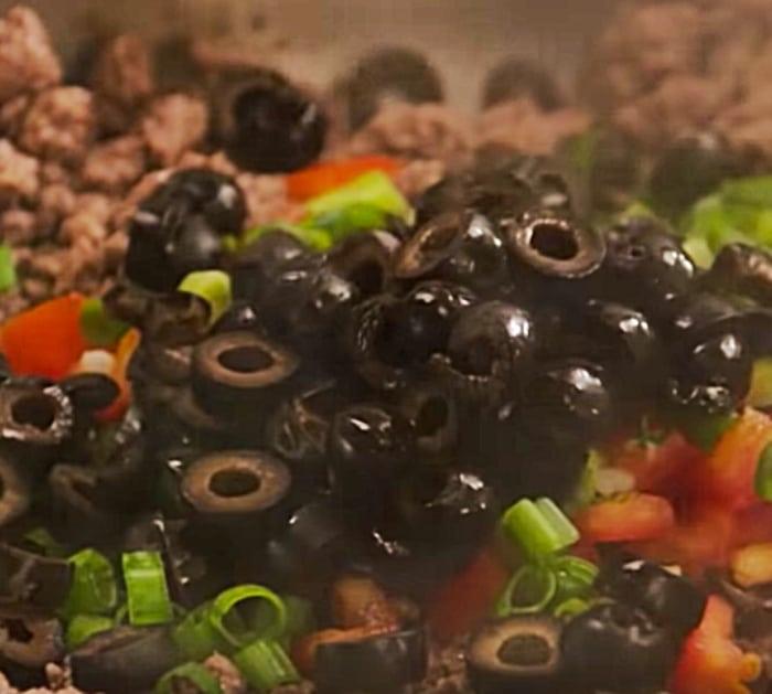 Make a delicious 7 layer bean and meat dip for NYE