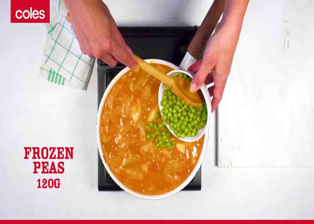 Adding the peas to the sausage mixture