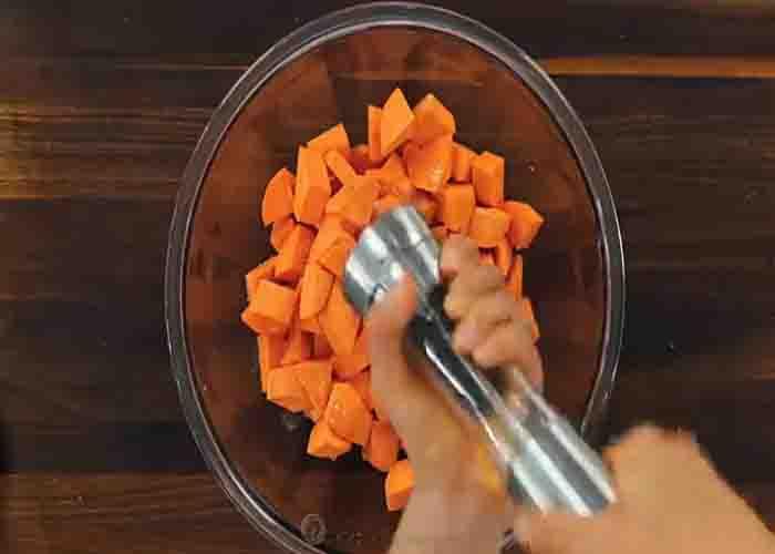 Seasoning the sweet potatoes for the roasted sweet potato salad recipe