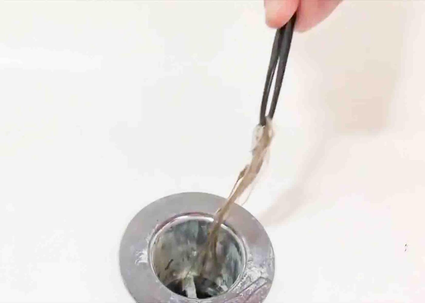 Removing the hair strands from the drain