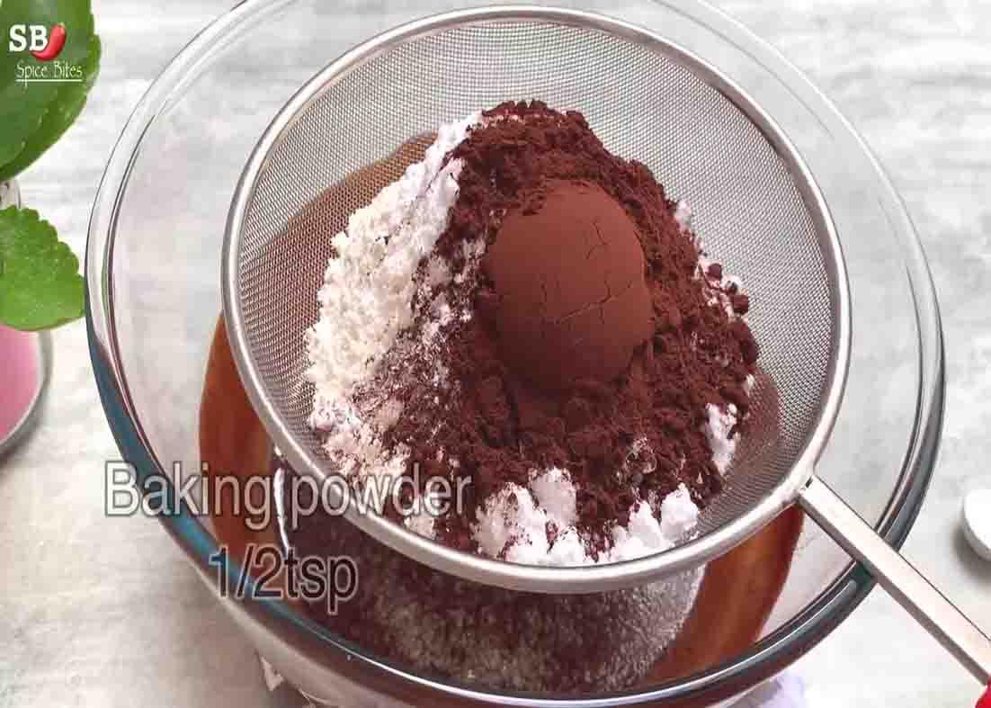 Sieving the dry ingredients of the chocolate brownie box recipe