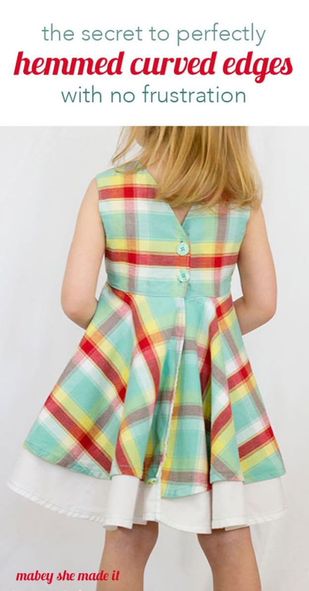 The secret to hemming curved edges, the back of a plaid and white circle skirt with a smooth flat hem on a child model