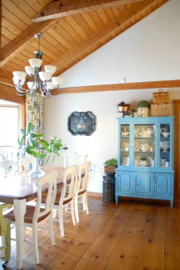 DIY wide plank pine floors, twelve inch pine boards top nailed in a dining room under a vaulted wood ceiling