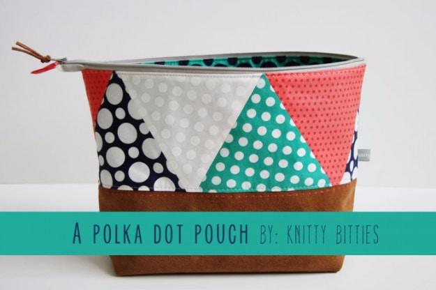 Zip pouch with a pieced triangle top in navy, coral and aqua polka dots over a tan suede leather base