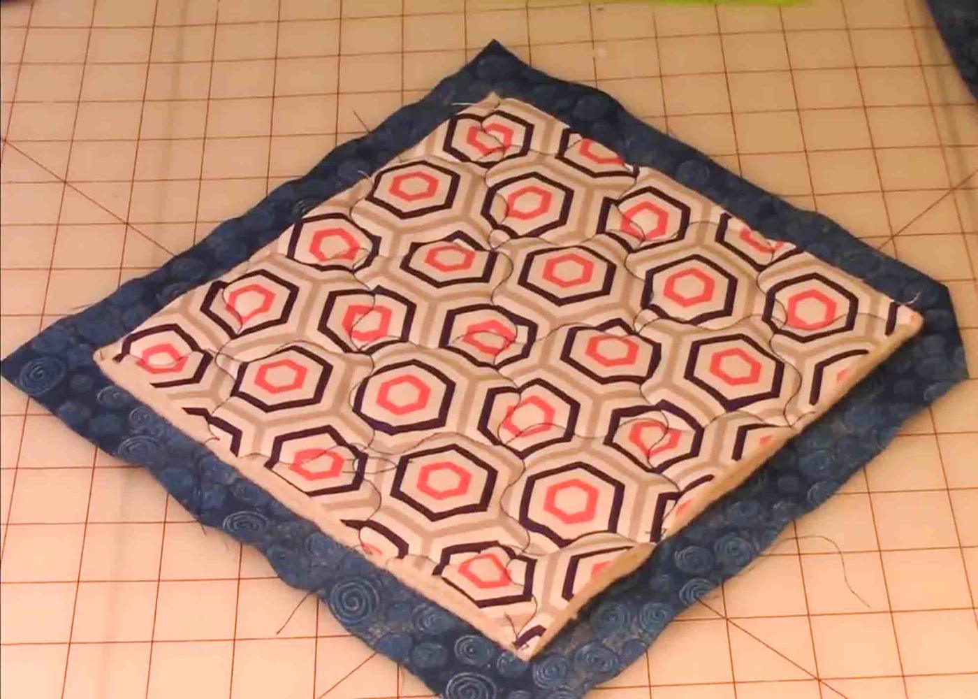 Stitching the edges of the potholders