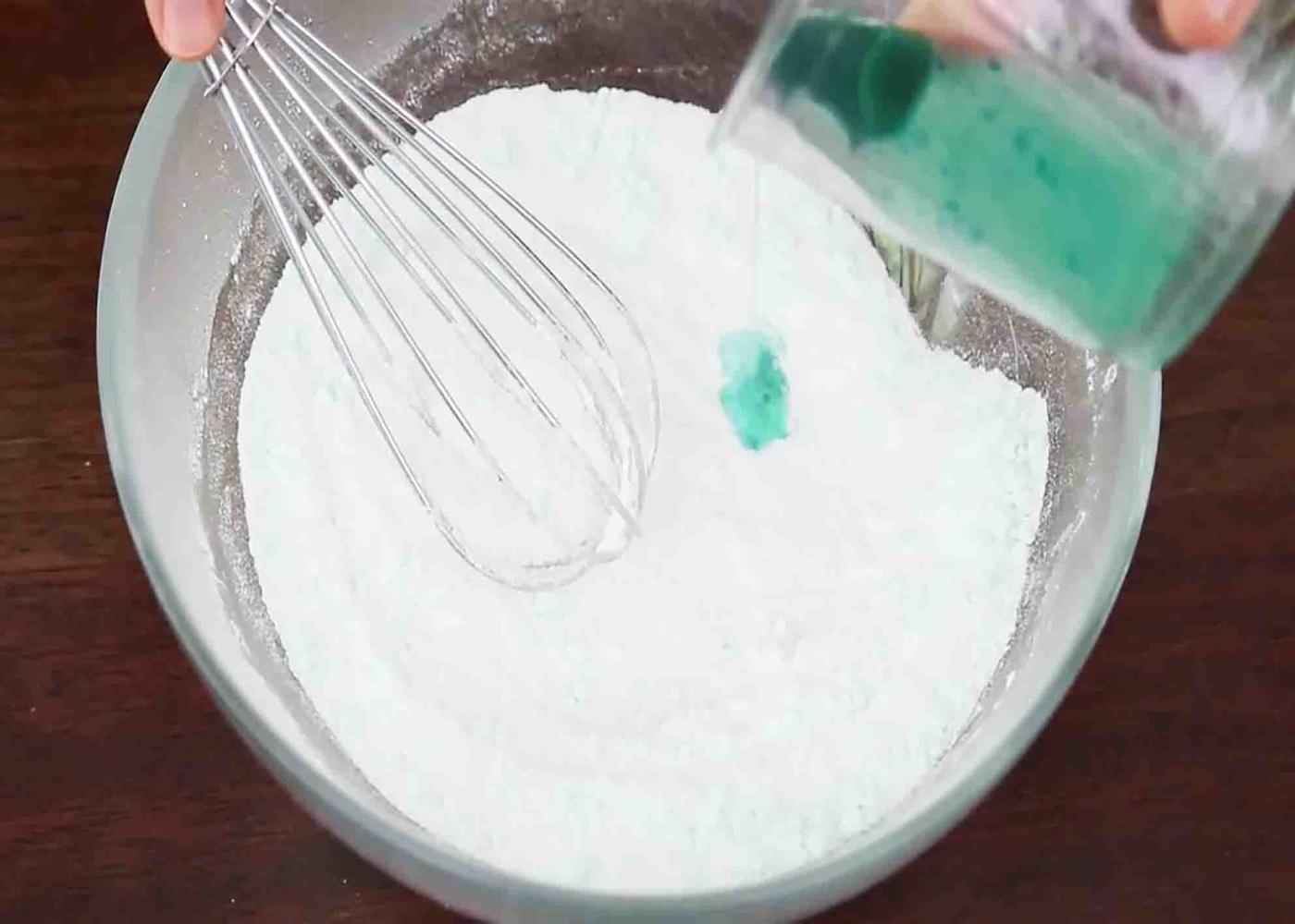 Mixing the dry and wet ingredients together for the perfect bath bomb