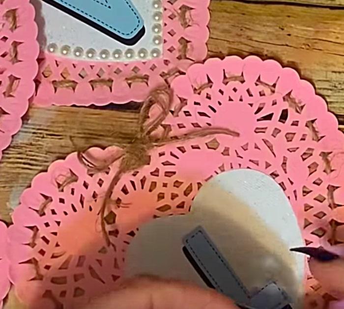 Learn to make a DIY Paper Doily Heart Banner with materials from Dollar Tree