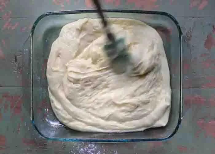 Transferring the lemon bars batter to the baking dish