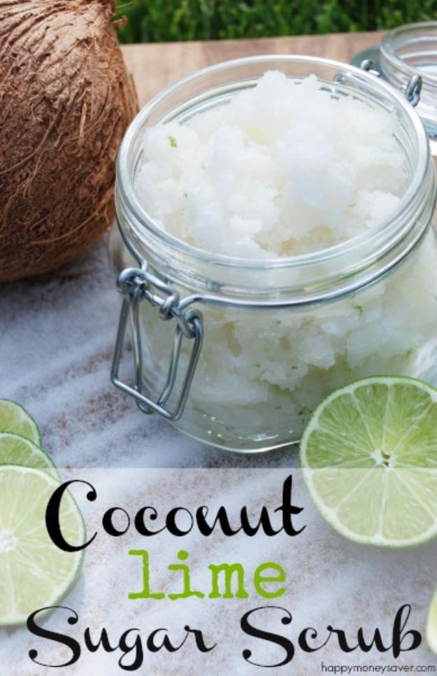 Coconut lime sugar scrub in a clear glass clamp jar with a whole brown coconut and a fresh cut lime beside it