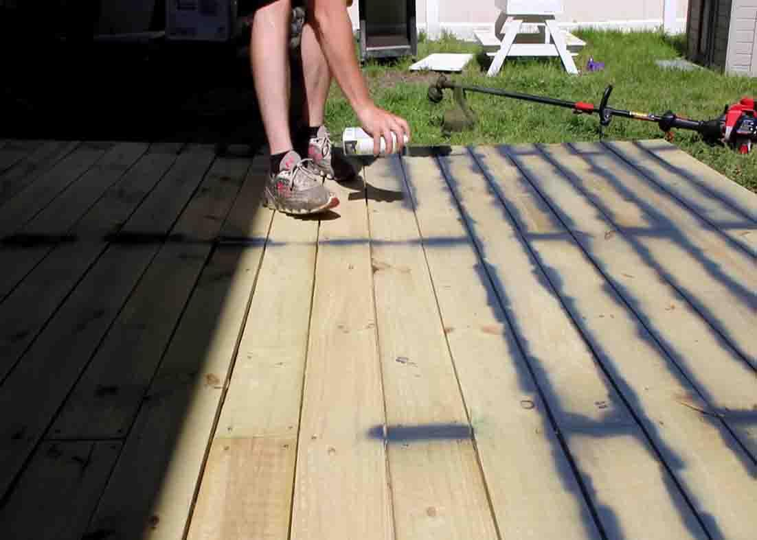 Paint spraying the gaps in the deck