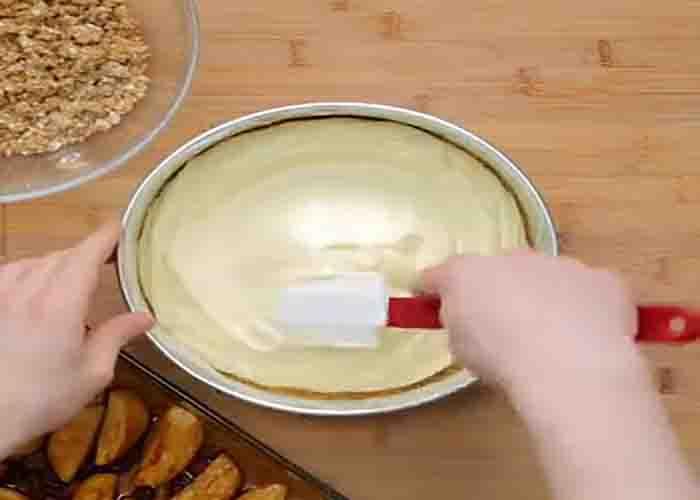 Assembling the apple crumble cheesecake