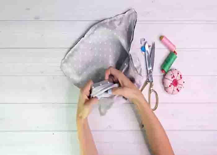 Turning the pom pom cushion cover inside out