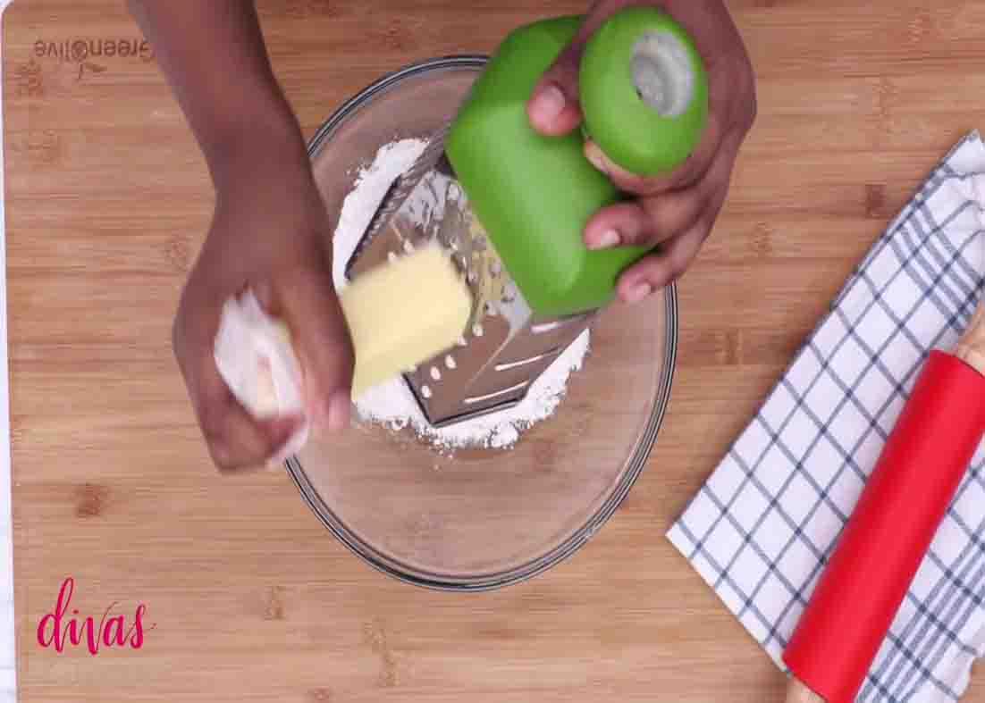 Grating the cold butter for the buttermilk biscuit