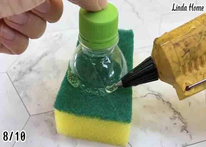 Attaching a bottle to a sponge to make a DIY dish washer