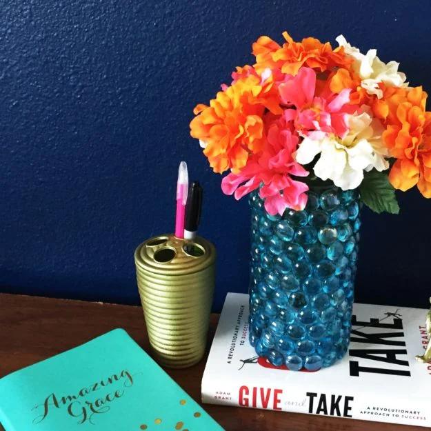 DIY bead vase built from flat glass marbles and a plain vase for a sleek and genuinely stunning decor piece