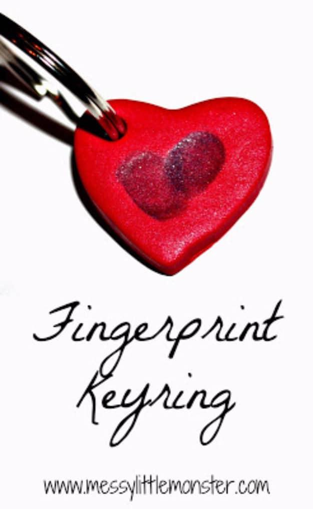 Clay keyring with two thumbprints pressed into a heart shape baked and strung on a metal ring for Valentine's decorating