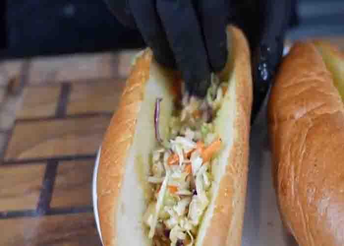 Assembling the firecracker salmon roll sandwich