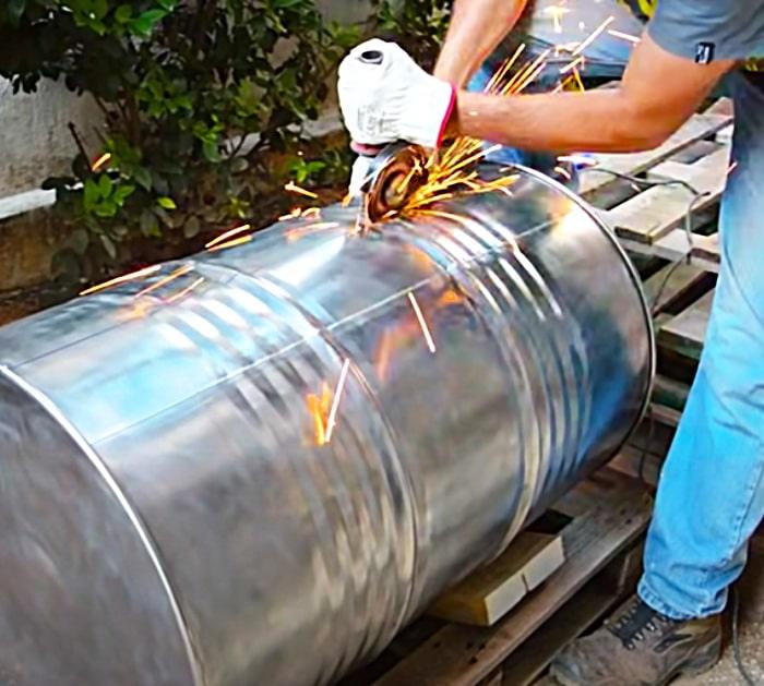 Cut Open A Metal Barrel To Make A Homemade Barbecue Pit And Smoker