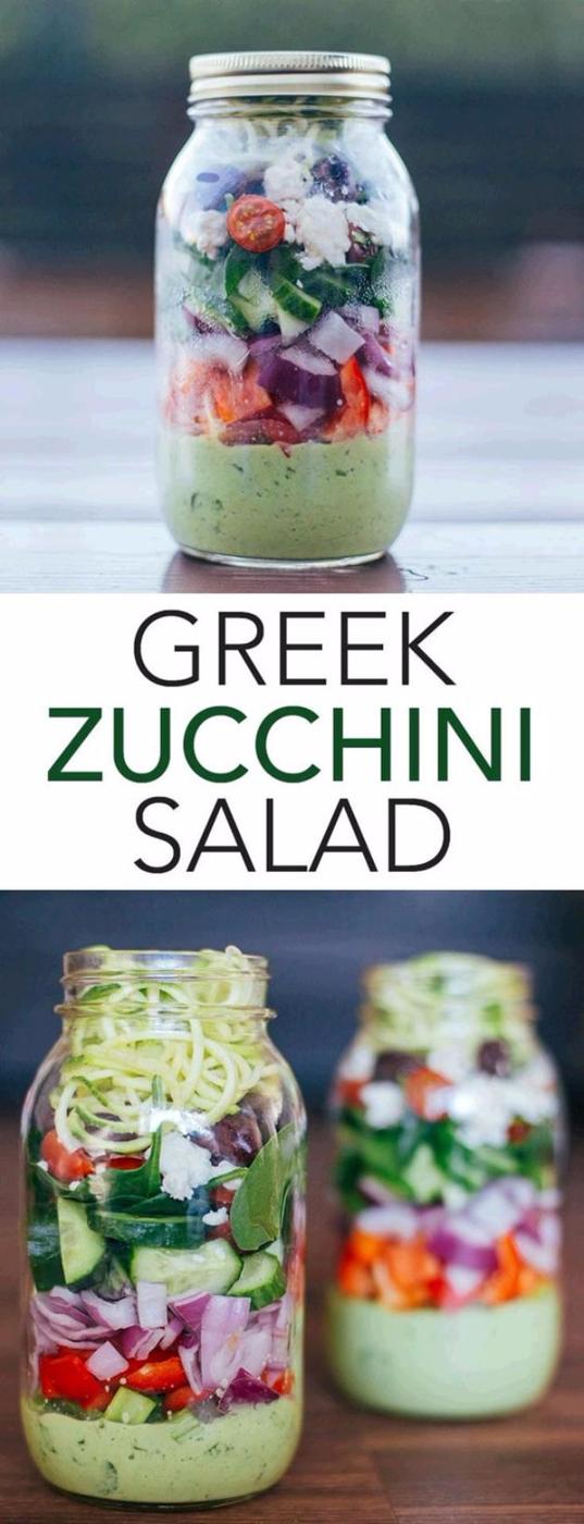 Greek zucchini salad in a mason jar with avocado yogurt dressing, peppers, cucumber, feta and spiralized zucchini