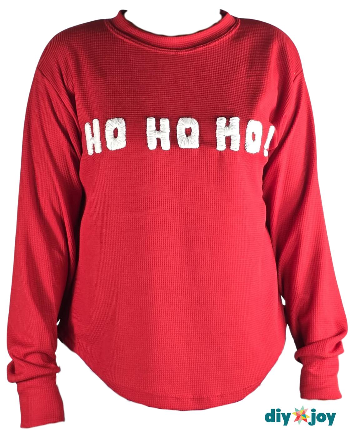 Easy Crafts - a full red long sleeve waffle knit sweater laid flat on white with HO HO HO embroidered across the chest in white