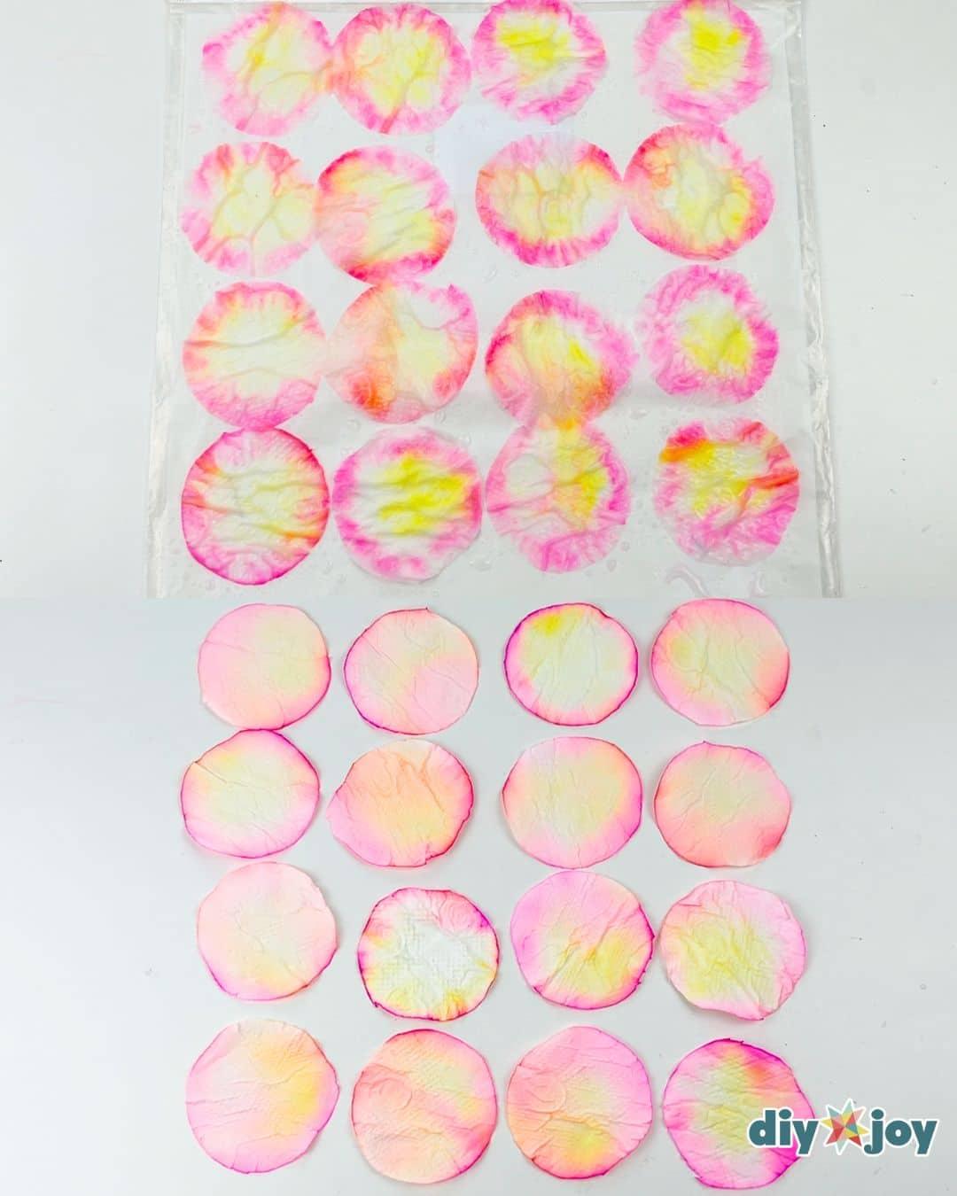 Spraying step, water misted over colored tissue petals to blend the marker on homemade paper flowers
