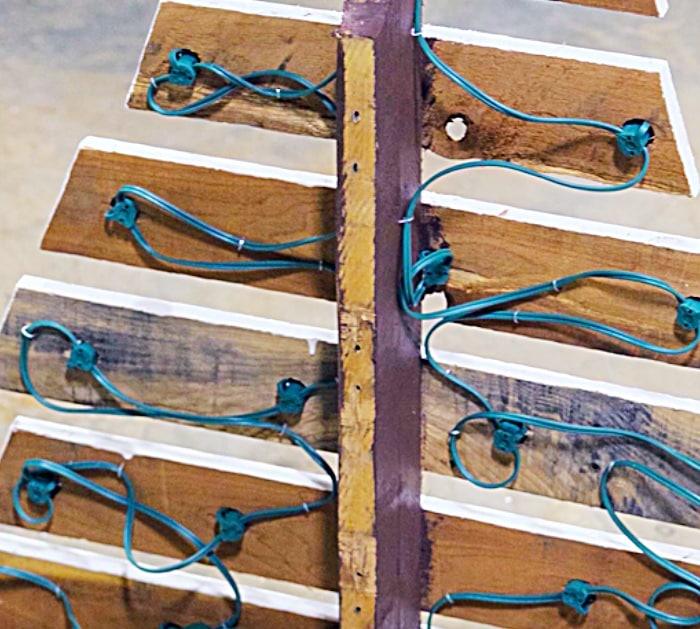 Learn to make a DIY Christmas Tree with marquee lights out of a recycled pallet