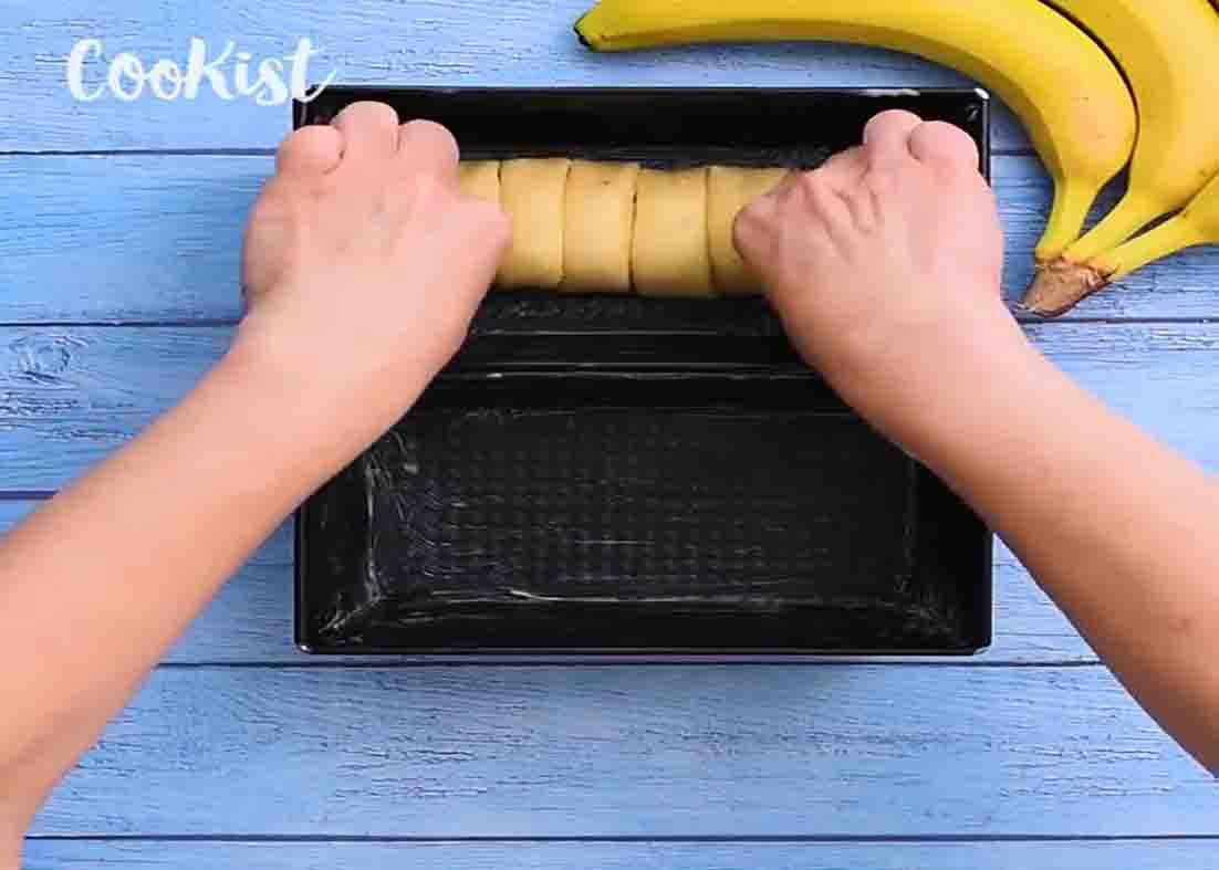 Placing the banana bread dough to the loaf pan