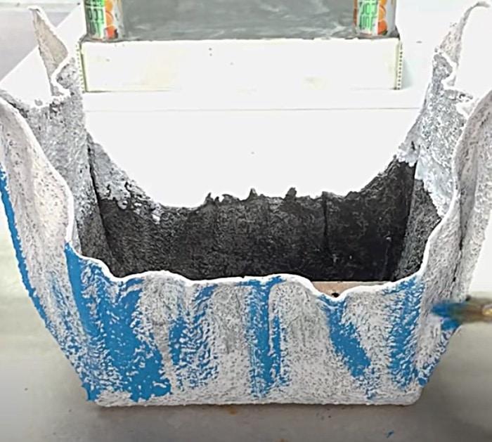 Cement soaked towels make new planters for the patio