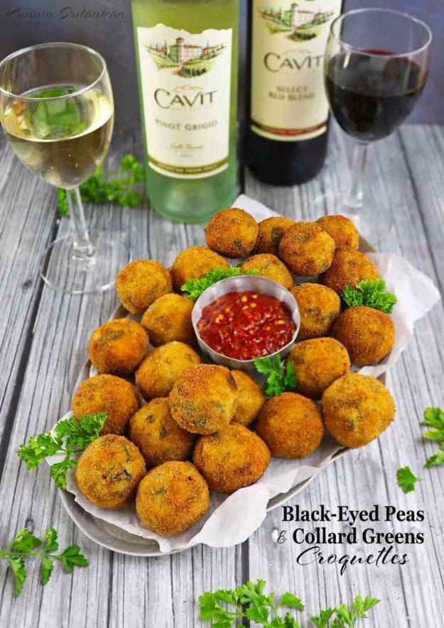 Black-eyed peas and collard greens croquettes fried golden, piled on paper with a bowl of chili dipping sauce