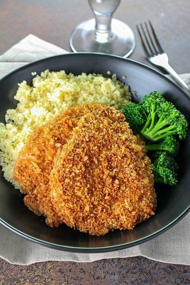 Baked pork chops in a crisp golden panko crust, breaded pork chop recipes plated with couscous and broccolini