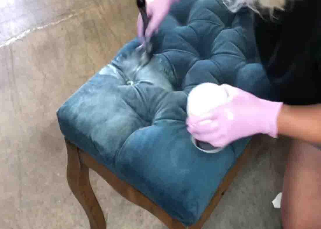 Applying the liquid patina to lock the paint on the upholstery