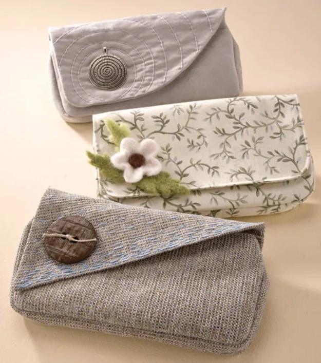 Three foldover clutch purses sharing one pattern with a tweed, a suede and a printed flap on a cream background