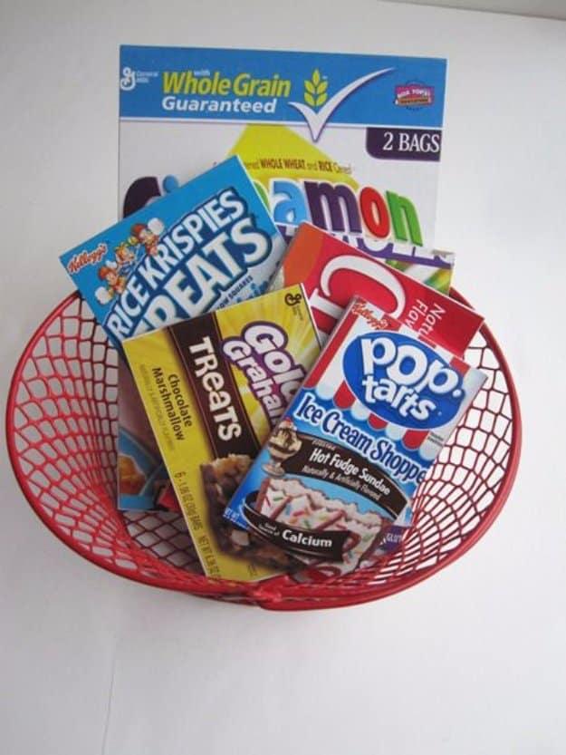 A stack of chunky little notepads bound at the top, their covers cut from bright printed cereal box cardboard