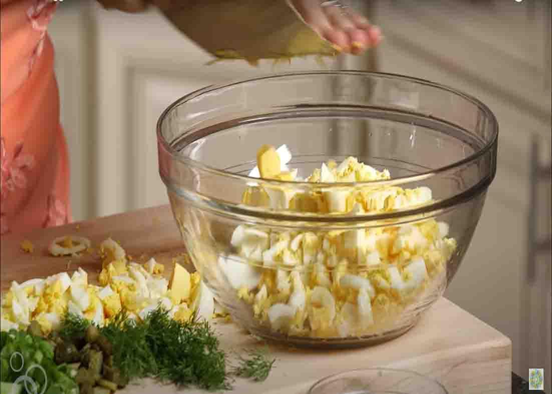 Combining all the ingredients for the egg salad sandwich recipe