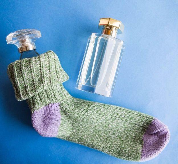 Packing Tips for Travel - Protect Breakables By Slipping Them Into Socks - Easy Ideas for Packing a Suitcase To Maximize Space - Tricks and Hacks for Folding Clothes, Storing Toile