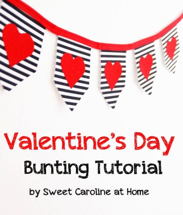 Bold pink and red triangle bunting strung across a doorway as bright DIY Valentine's Day decoration for a handmade gift