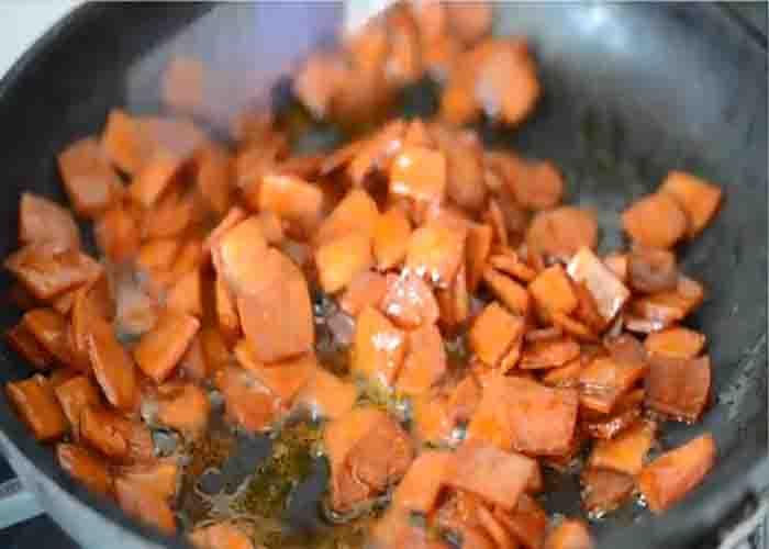 Frying the pepperoni for the pizza party bread recipe