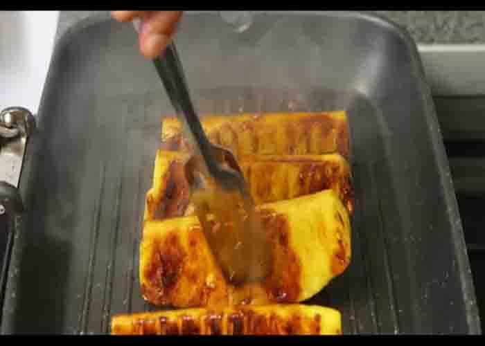 Grilling the pineapple wedges